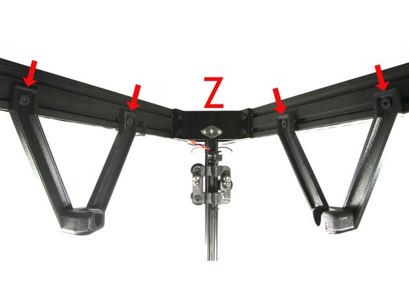 The spool axle is taped shut at both ends, inside you will find two pieces of wire. These will be used in an upcoming step to install the wiring harness.
