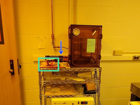 The multimeter is located to the left of the vacuum chamber.