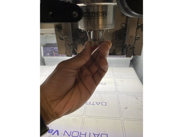 Screw the collet back into the spindle. Be careful to not overtighten the collet, in the spindle.