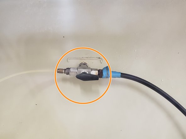 When the valve is in the upright position, the pressure is off for both hoses