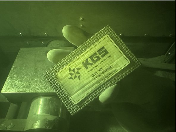 Insert your hand palm up, and the 60 grit sanding block underneath the Carriage.