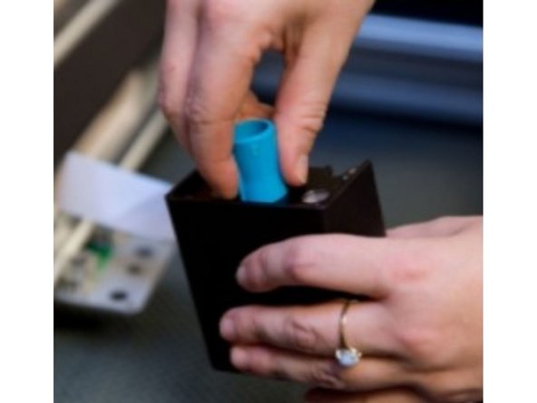 Grasp the printer head and pull gently up and back to remove