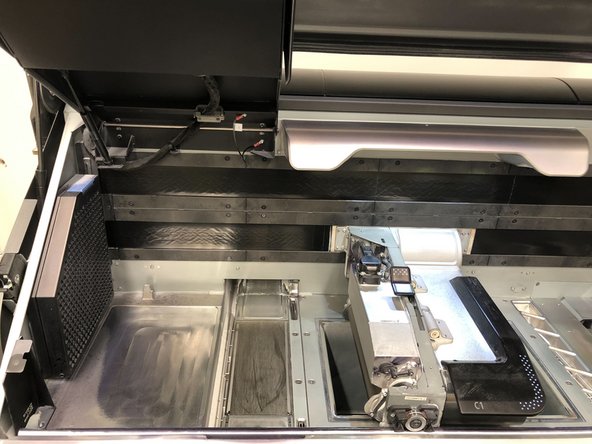 Move the fusing carriage to the right and lift up the front panel