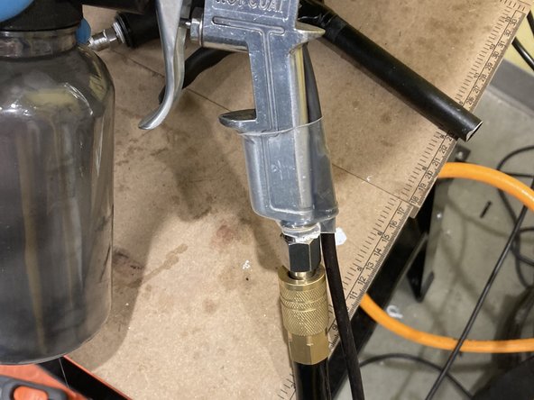 Turn the air supply off so the powder gun does not spray by accident