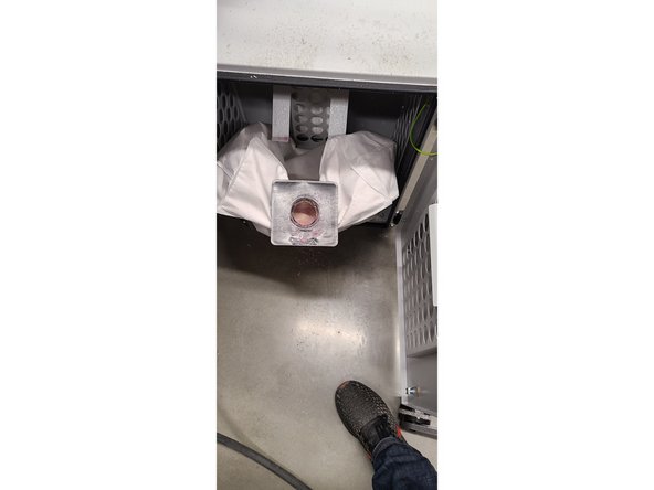 Second, slide the bag down from the prongs and remove from machine. (Picture 3)