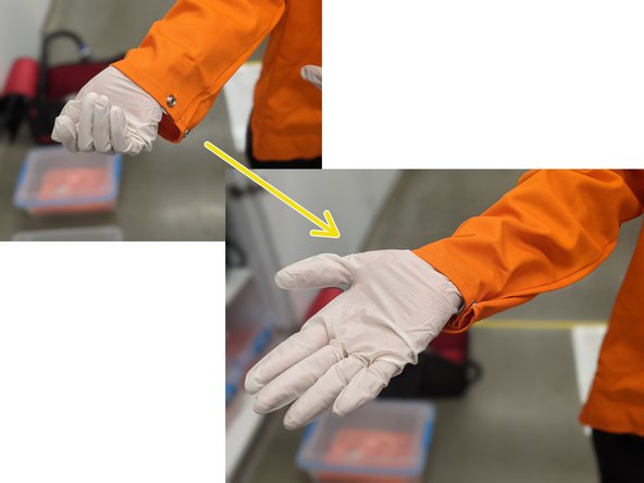 With gloves on, remove the top of the container and slowly remove the jacket from inside