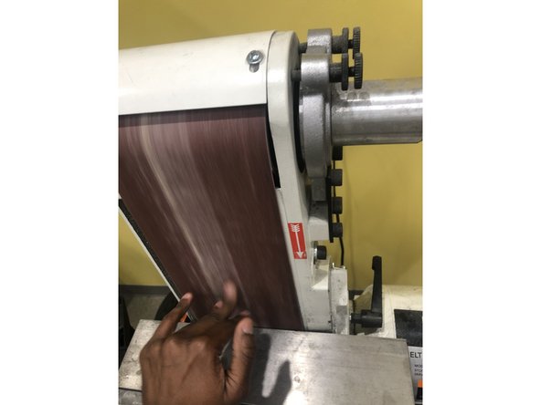 To verify alignment, rotate the belt (by hand) and observe how it tracks. The belt should run centered on the belt wheels.