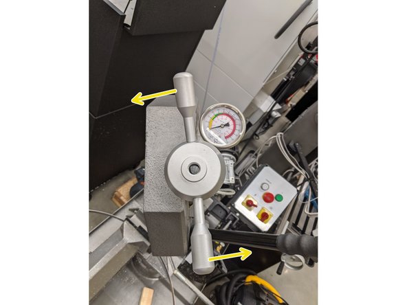 Use the hand wheel to release the tension on the blade by slowly turning it in an anti-clockwise manner until the dial reads 0 kPsi (in the yellow zone)