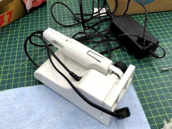 Remove the Ultrasonic Cutter from its box and plug it in