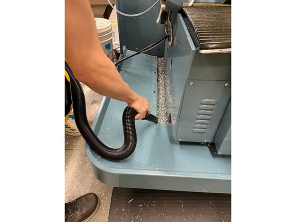 Use the vacuum to clean up all the chips inside the pan