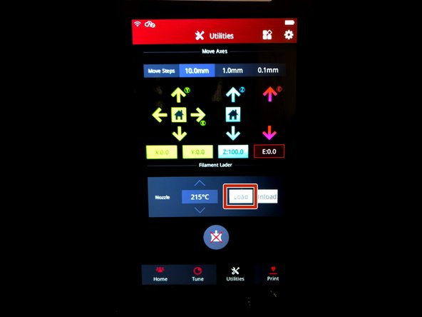 Press &quot;Load&quot; from the utilities menu on the touchscreen