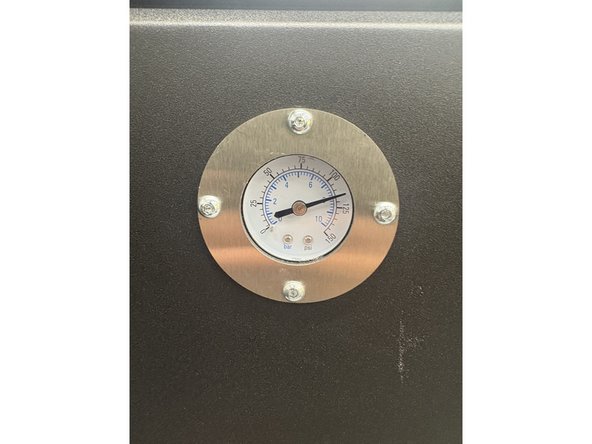 Step 4: Look at the outside of the sandblaster. Take notice of the latches to open the door. The pressure gauge, which tracks the psi of the static nozzle. Also the knob on the left side of the machine to adjust pressure.