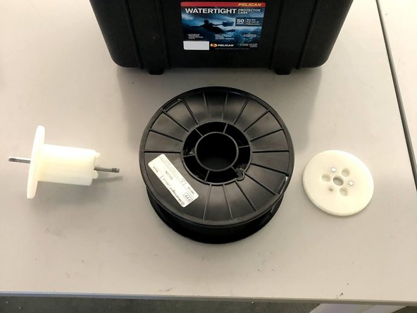 Open your drybox and remove the spindle from the inside