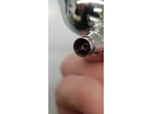 Take a close look at the nozzle at the end of the brush. As you move the control button on the brush back and forth, the small needle sticking out of the nozzle should visibly move in and out of the brush nozzle.