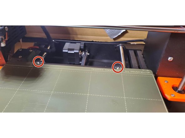 Hold the build plate at an angle from the heatbed so the magnets do not pull the plate down