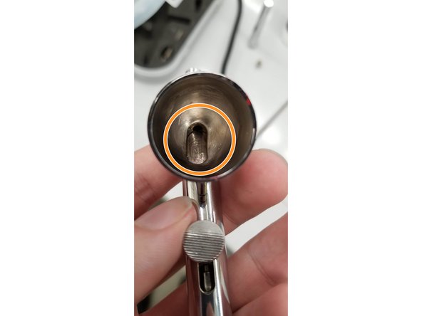 Flush out the inside of the airbrush with IPA and airbrush cleaner fluid. Paint tends to accumulate in the circled region underneath the needle. You can use a cotton swap with IPA on it to scrub out the paint chamber.