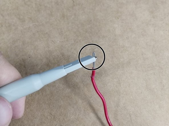 You can also pull the plastic cover off to reveal a sharp point which can be inserted into the breadboard.