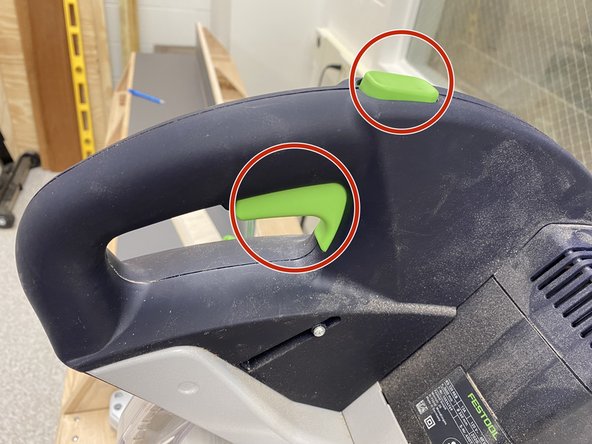 To cut, simply push down both the top and bottom green buttons on the handle at the same time.