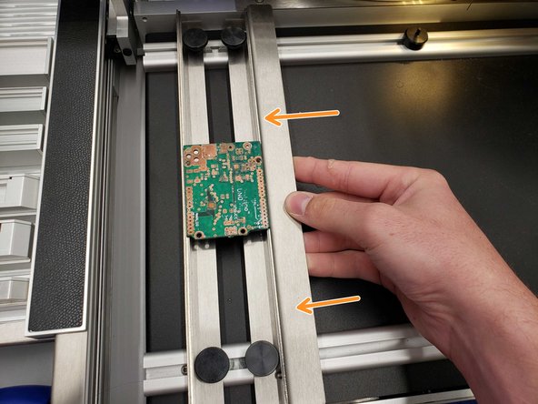 Adjust it until the board lays firmly between the two laths.