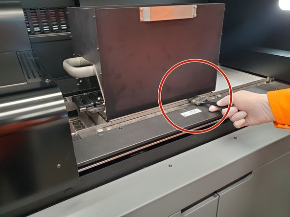 Raising the build area can release some loose powder, so this step is critical to avoiding extra powder contamination