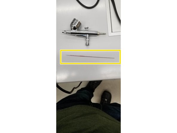 CAREFULLY remove the needle from the brush and set it to the side. The tip of the needle is very delicate, be gentle so it doesn't get bent.