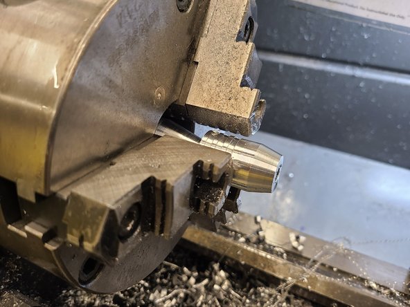 Checkpoint 4: Parting the stage from the stock and turning down the taper (Pictures 1 and 2). This step requires the face milling tool and the parting tool.