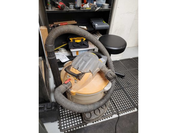The shop vac is used to clear debres off the table and ground.