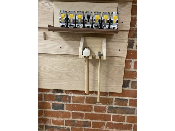 For scraping glue, you want to hold the chisel at a low angle with the face of the wood, as shown in the picture, to minimize taking off excess material.