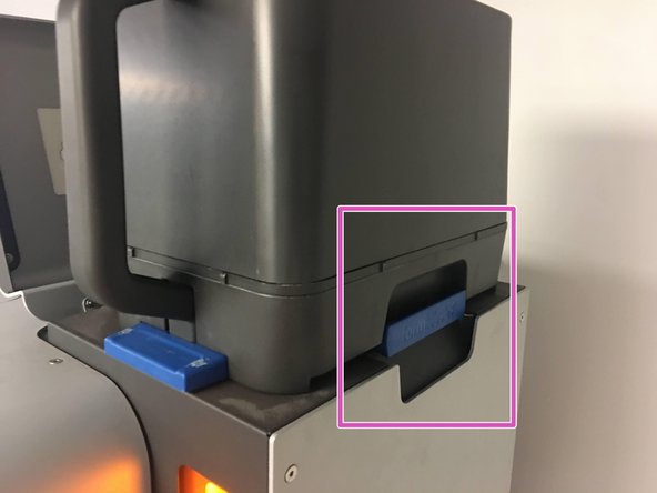 Transfer the Powder Bin to the Fuse, and place it on the hopper so that the blue handle on the Bin is facing towards the right hand side of the Fuse