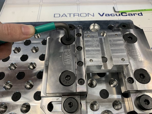 Tighten mounting bolts on the pallet first. Then tighten the clamping bolts to move the jaw inwards and grip the part.