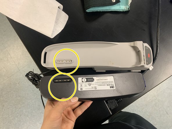 Plug in battery charger to an outlet