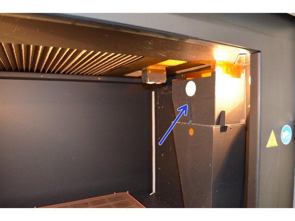 Remove debris chute hood by lifting straight up