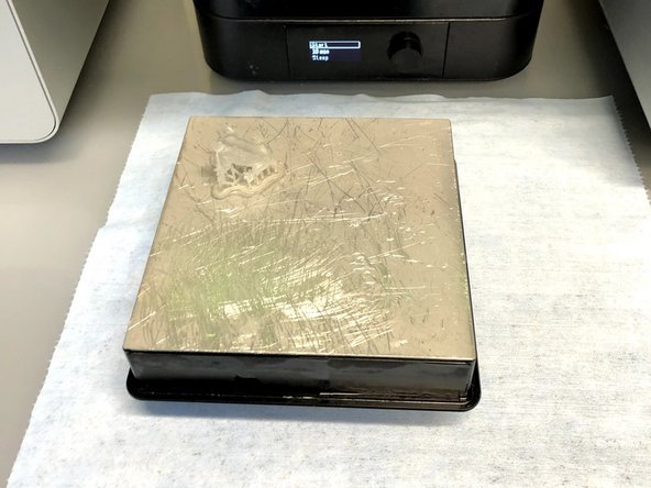 Remove the build plate and rotate it so that the part is upright