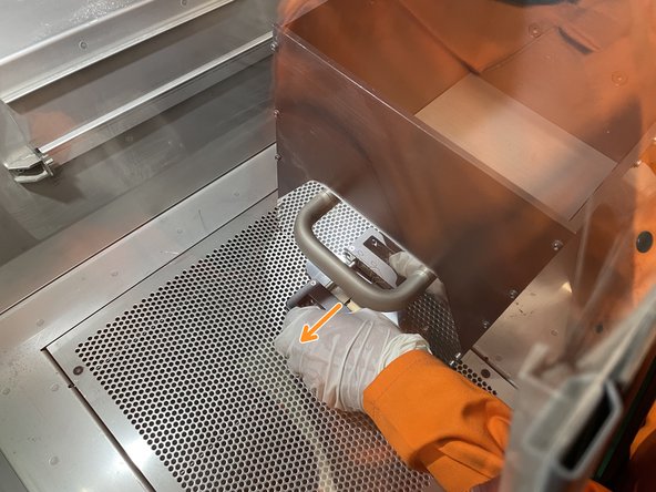 Release and remove the black gasket around the base of the build box