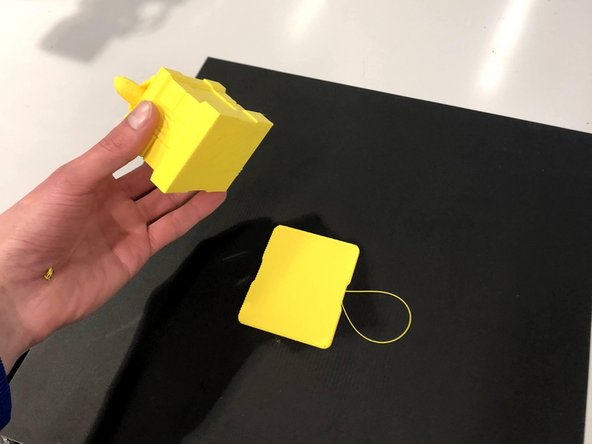 If the model does not easily pop off place the build plate on a flat surface