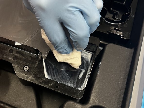 Clean the top corners of the tank as well as the pouring spout.