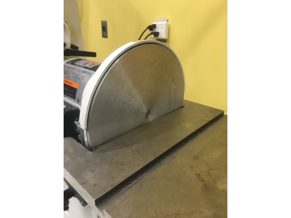 First, use the putty knife to scrape the adhesive residue and excess paper left from the old pad.