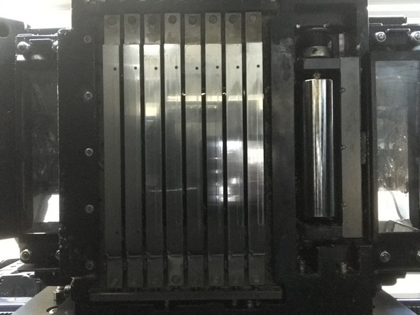 Follow steps, cleaning UV lamps, roller, and print heads