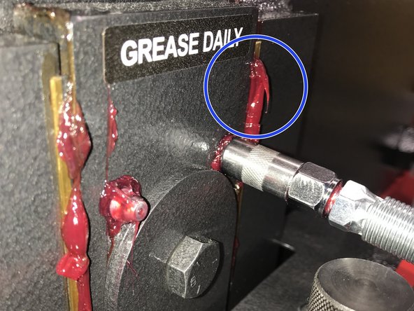 Pump the grease by gripping the handle together.