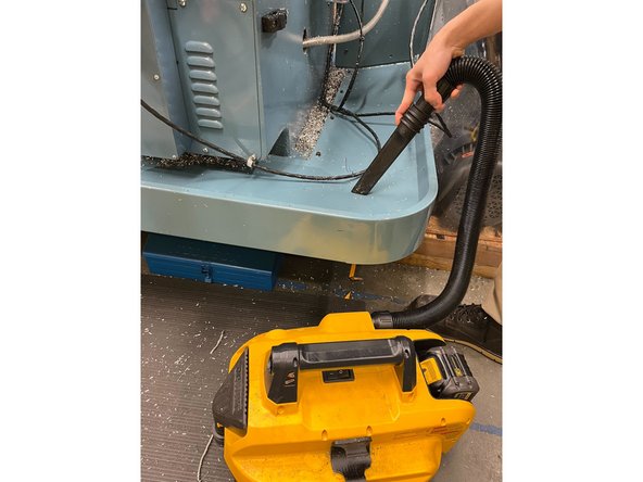 Use the vacuum to clean up all the chips inside the pan