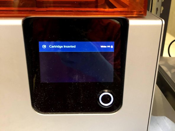 Proceed to lower the cartridge into place at the back of the machine