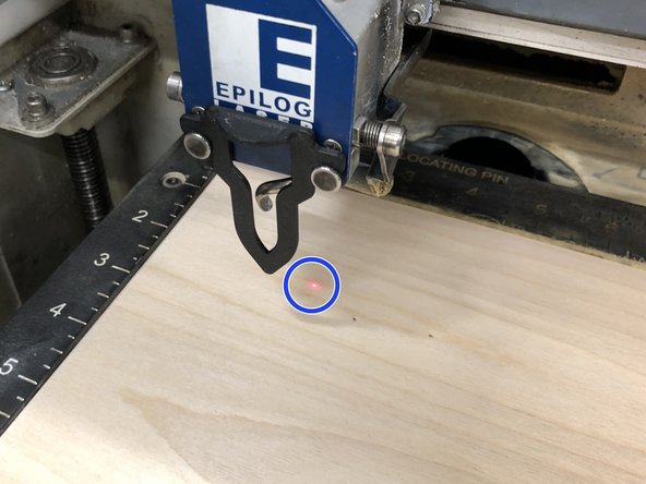 This red dot shows you where, (blue circle), the actual laser will cut and where your laser position will be.