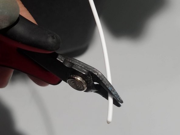 Cut the plastic filament at a 45 degree angle