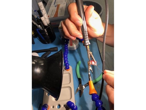 Move the wire all around each socket so there are no open holes in any of them. A magnifying glass can be helpful during this process.