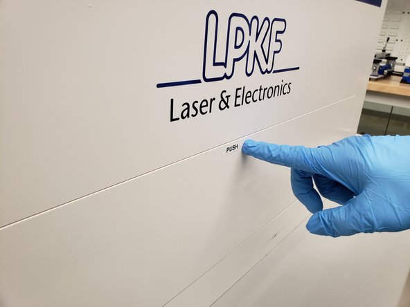 Open the cover on the front of the Contac by pushing on it