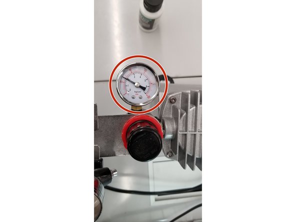 Turn the air compressor on and wait for the pressure to level out. Press and hold the control button of the brush down and see what pressure the gauge settles at. This is the working pressure. Check the paint container you will be using and make sure the working pressure is in the recommended range for your paint.