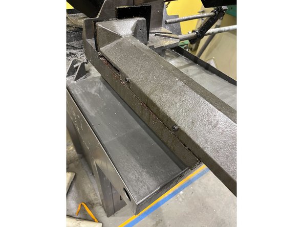 Use a brush and paper towels to sweep up any chips on the table and everything around it (see images)