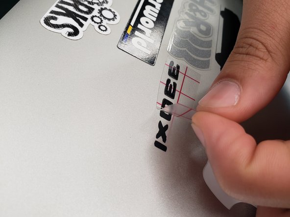 Once the sticker is set, SLOWLY and CAREFULLY remove the transfer paper