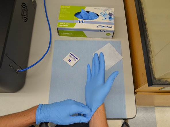 Only hold the lens by the metal holder.