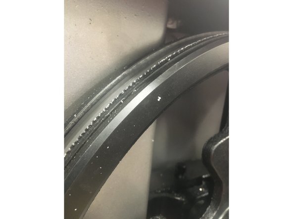 Begin to tighten the blade by turning the tension wheel clockwise until the blade stays in place.